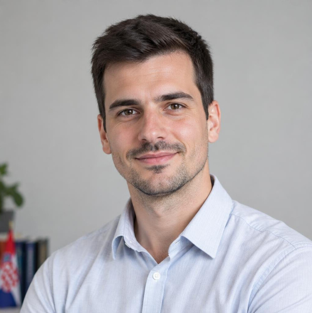 Portrait of a man in a shirt looking at the camera
