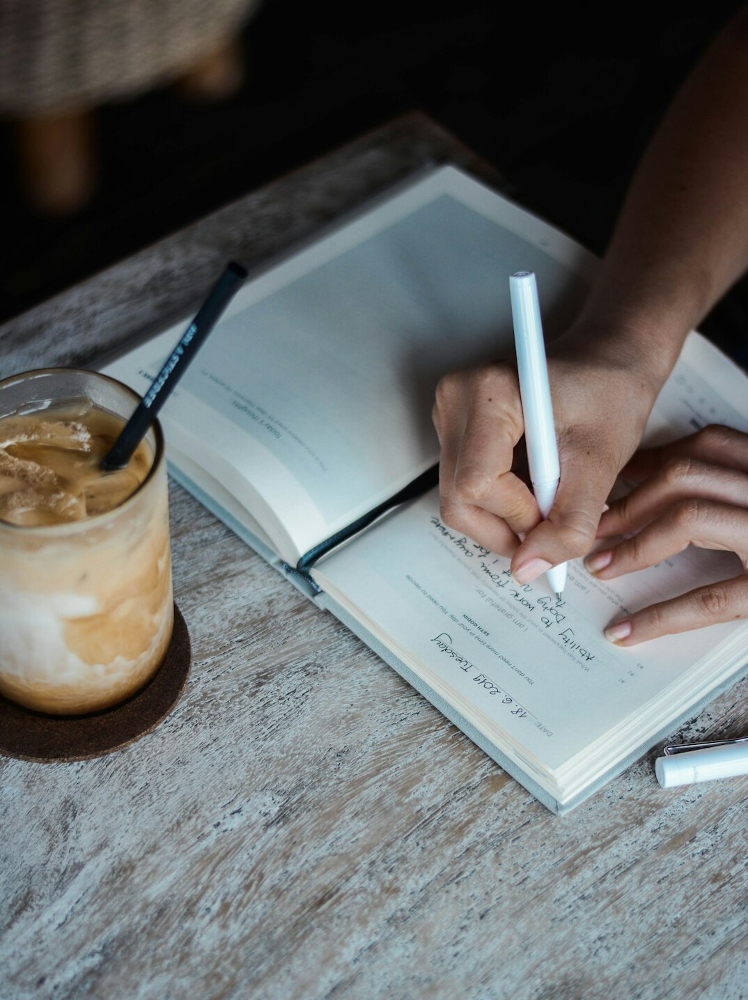 woman writing in journal